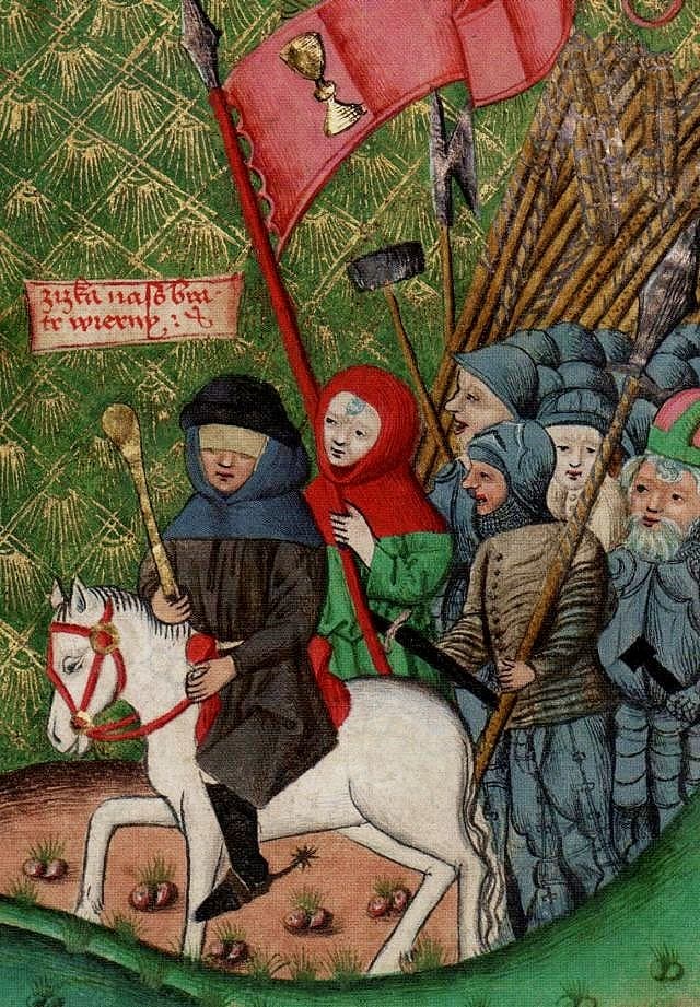 Jan Žižka v prosté sukni s úzkými rukávy a praporečník v prosté sukni s širokými rukávy. Výřez z Jenského kodexu (1490-1510).