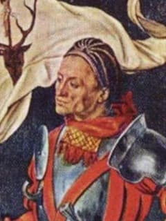Svatý Eustach má kolem krku ozdobnou kápi se střapci. Výřez z Paumgartnerova oltáře, 1500.